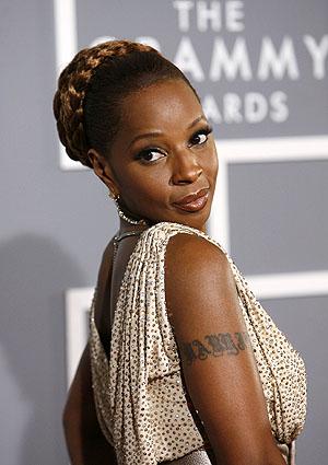 Mary J Blige Name tattoo right arm | Celebrity Tattoo Removal